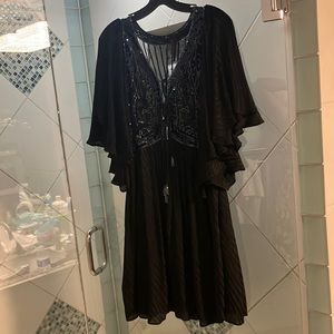 DesignerFree People.  Mesh and Sequins.  Tassels in Front.  Tie front over bust.